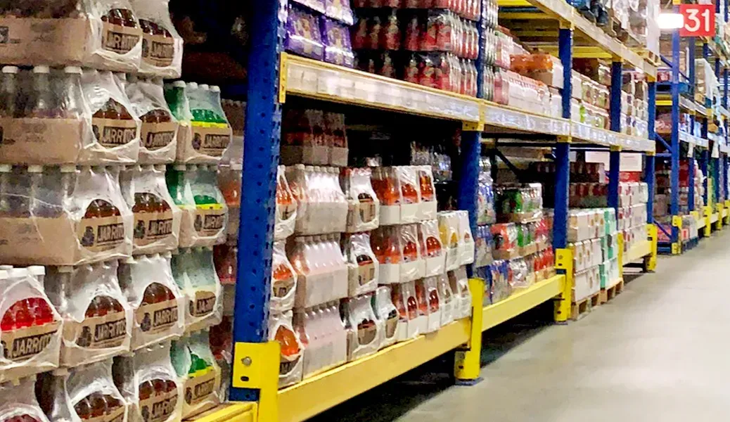 Warehouse shelves stocked with wholesale food products at Canton Food Co.
